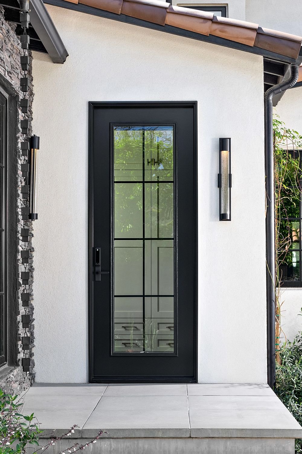 The Twilight door in the Ensemble Designer Collection. Laurie March designed Twilight. This is her door. It is black with equal lite grilles.